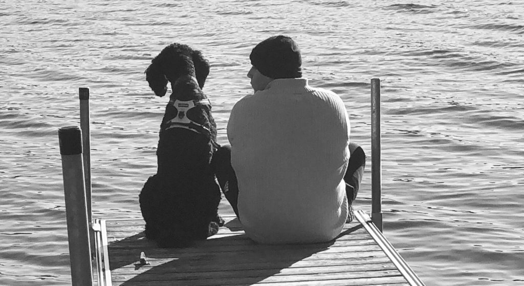 Toby and Eddy sitting on a dock